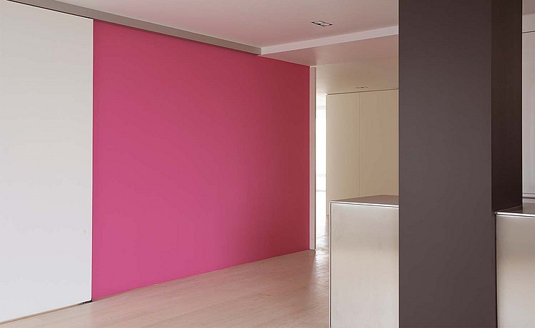 A pink wall in a room